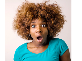 Black woman with shocked expression on her face